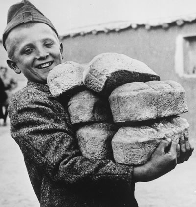 Boy with Loaves of Bread